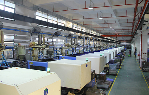 Injection molding machines at KING DA factory, specializing in precision plastic manufacturing for detailed and complex designs.