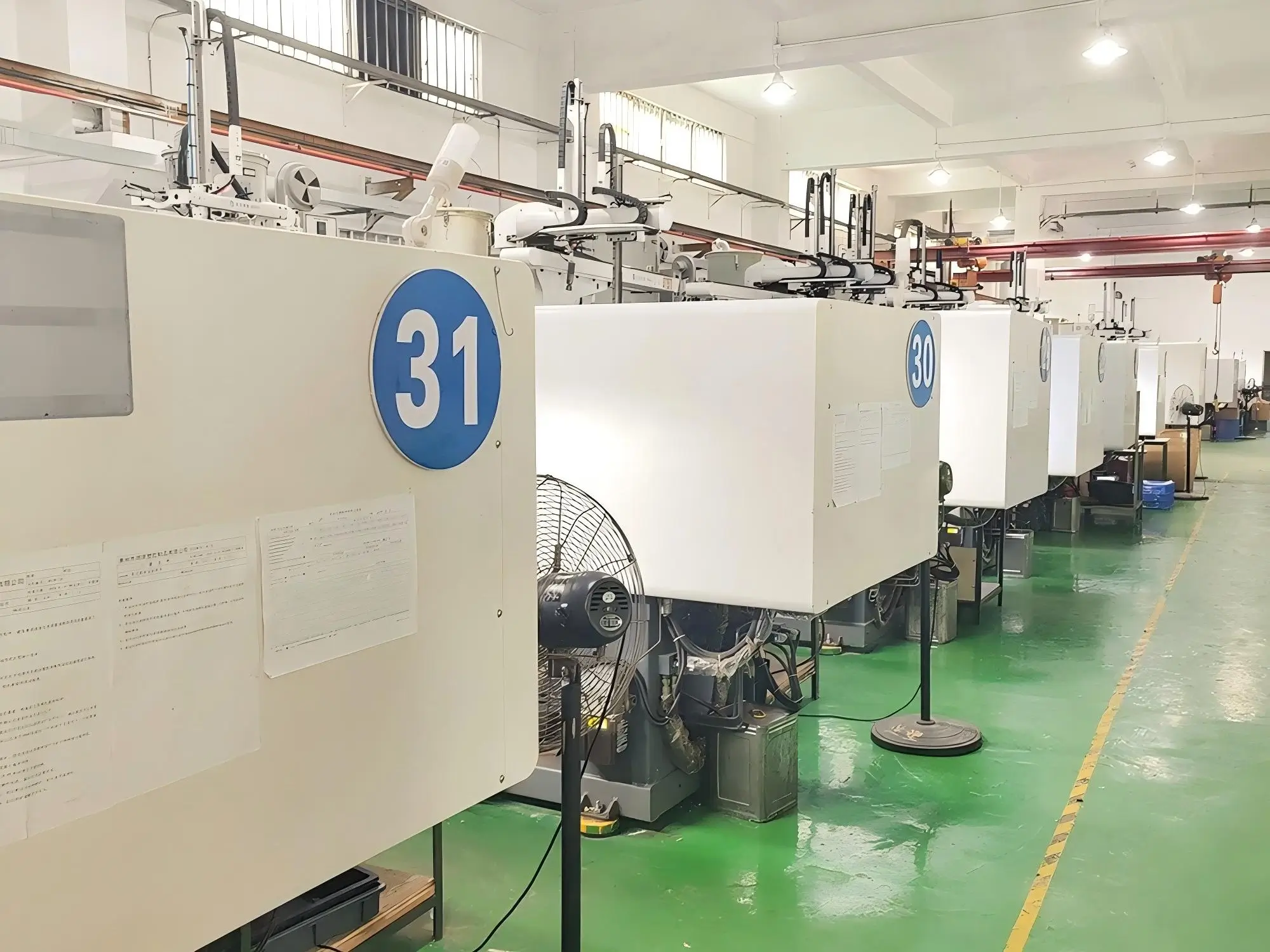 Industrial injection molding machines in KingDa toy factory production floor